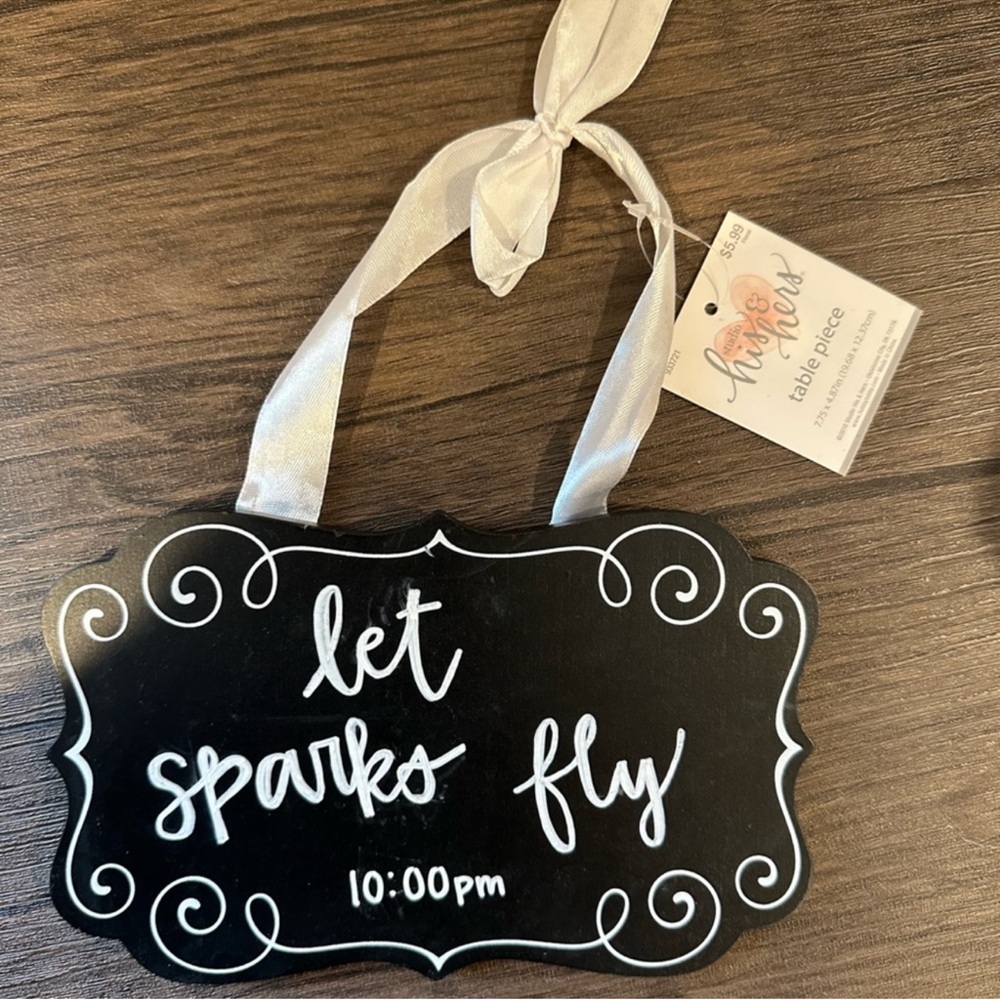 Black Hanging Sign with White Ribbon